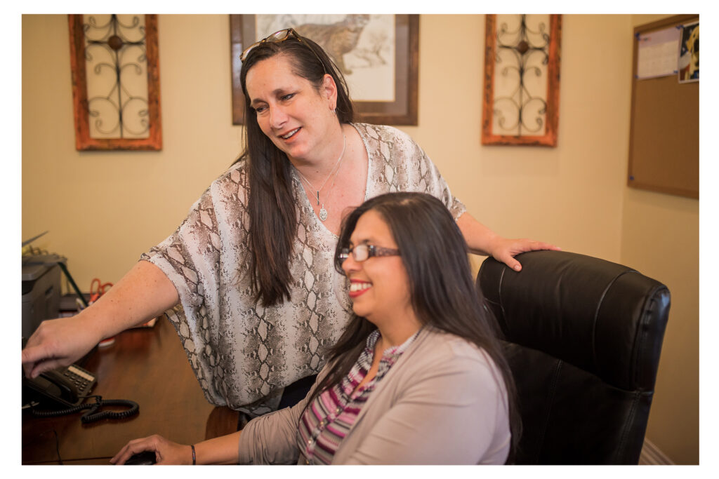 Two accountants reviewing a new business process audit for a client